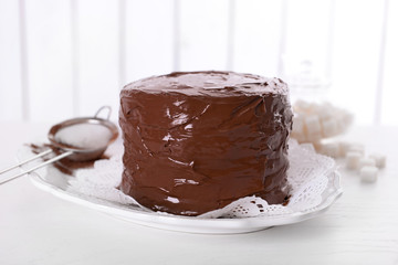 Tasty chocolate cake on light background