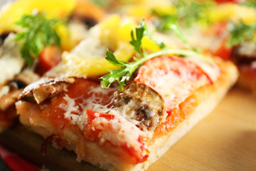 Pieces of delicious pizza on the table, close-up