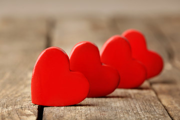 Fototapeta premium Wooden hearts on rustic wooden background