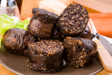 pieces of fried sausage in earthenware