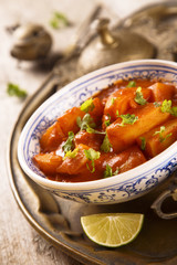 Potato curry with coconut and tomatoes
