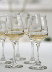 Glasses of white wine on table closeup
