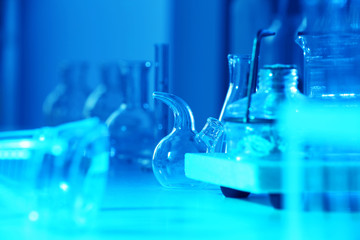 Test tubes and flasks on laboratory table closeup
