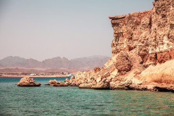 Beautiful cliffs on coast of the blue clear sea