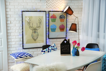 Modern room interior with table, chairs and lamp