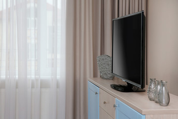 Obraz na płótnie Canvas Modern living room with big cupboard and TV.