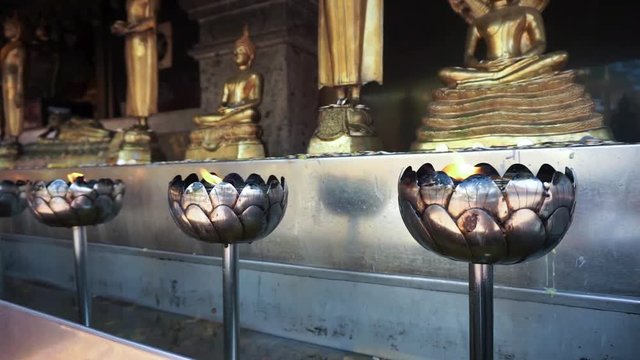 unsteady Moving light on metal lotus stand, worship Buddha image