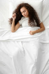 Beautiful girl sleeping in bed