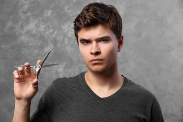 Handsome man with scissors