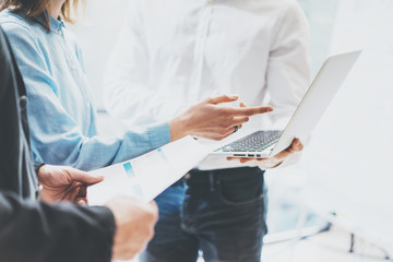 Business team work new ideas process. Photo professional crew working with startup project. Project managers meeting. Analyze business plans laptop. Blurred background, film effect. Horizontal