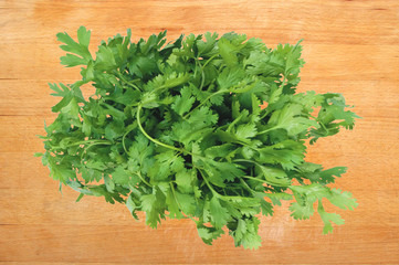 Parsley on wooden cutting board