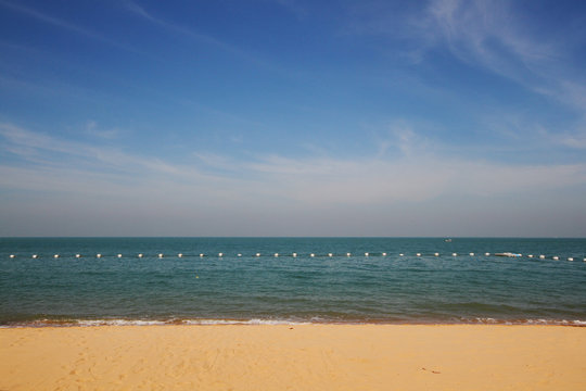 Fototapeta Sea wave on the beach with the blue sky