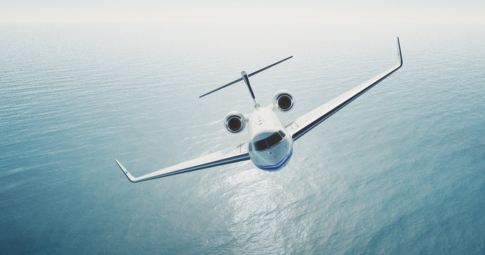 Photo of white luxury generic design private jet flying over the empty sea. Blue sky at background.Business travel concept. Horizontal . 3d rendering