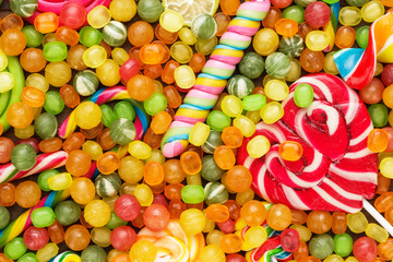 Fototapeta na wymiar different colorful sweets and lollipops on the table