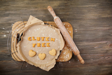 Gluten free made of crackers on parchment over wooden table
