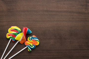 colorful sugar lollipop on the wooden table