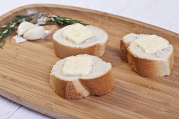 Obraz na płótnie Canvas baguette slices with butter