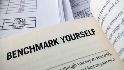 Obraz premium Benchmark yourself word on the book