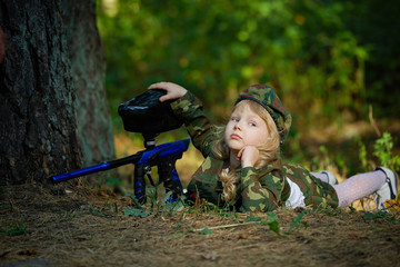 girl in camouflage suit with rifle