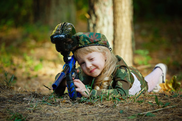 girl in camouflage suit with rifle