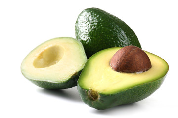 Halves of fresh avocado isolated on white