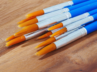 paintbrush on wooden background