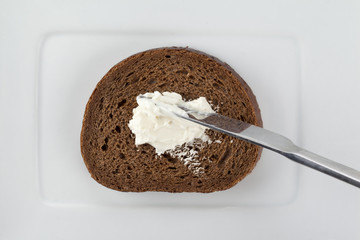 slice of chocolate bread with butter spread