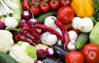 Background of fresh vegetables and greens closeup