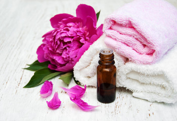 Fototapeta na wymiar Peony flowers and massage oils