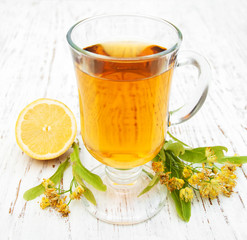 cup of herbal tea with linden flowers