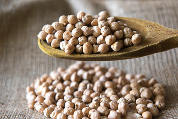 chickpeas on sackcloth with spoon