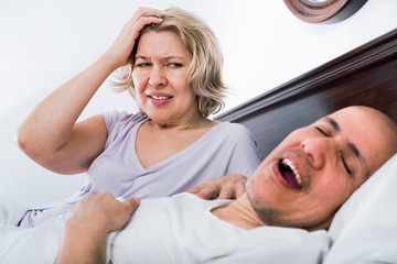 Mature woman disturbed with partner snores