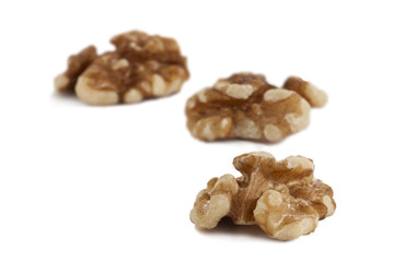 three peeled walnuts