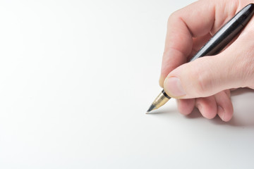 pen in the man's hand to signature