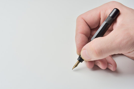 pen in the man's hand to signature