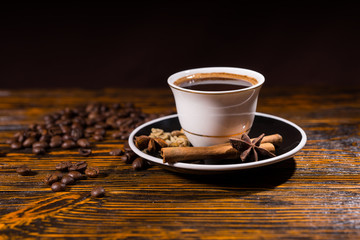 Cup of Coffee with Roasted Beans and Spices