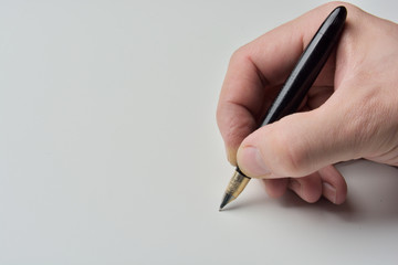 pen in the man's hand to signature