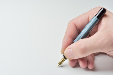 pen in the man's hand to signature
