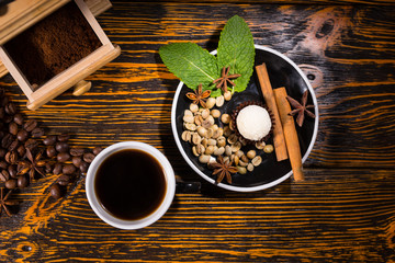 Cup of Coffee with Grinder and Plate of Garnishes