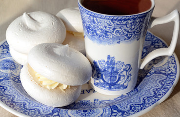 Meringue with cup of tea