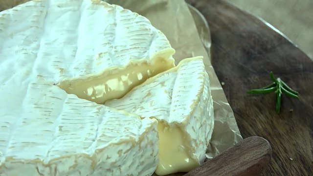 Portion of rotating creamy Camembert as detailed 4k footage (seamless loopable)