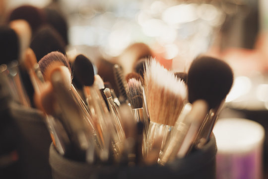 Fototapeta Professional visagiste brushes for make up.Set of brushes for facial makeup in beauty studio.Make up tools for professional visage on visagiste table in beauty salon