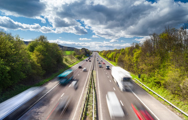 Vehicles in Motion on Busy Rural Motorway - obrazy, fototapety, plakaty