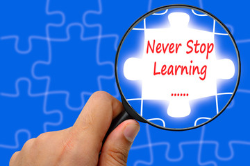 Never stop learning word. Magnifier and puzzles.