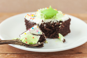 chocolate cake in wooden spoon