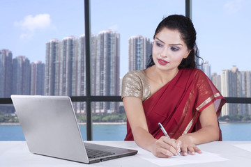 Indian businesswoman with sari in office