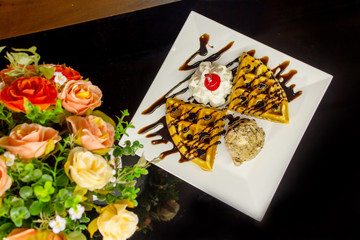 Sweet waffles with chocolate sauce