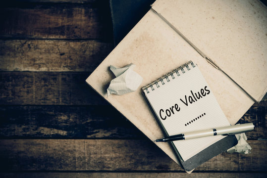 Core Values on pages sketch book on wood table vertical