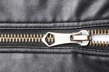 Black leather jacket metal zipper closeup. © Paweł Michałowski