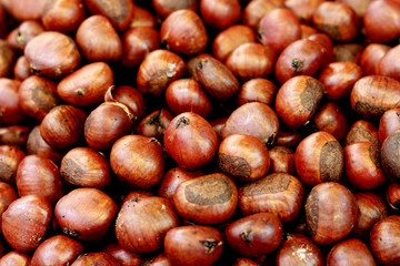 Chestnuts roasting.Dark background.Autumn background.